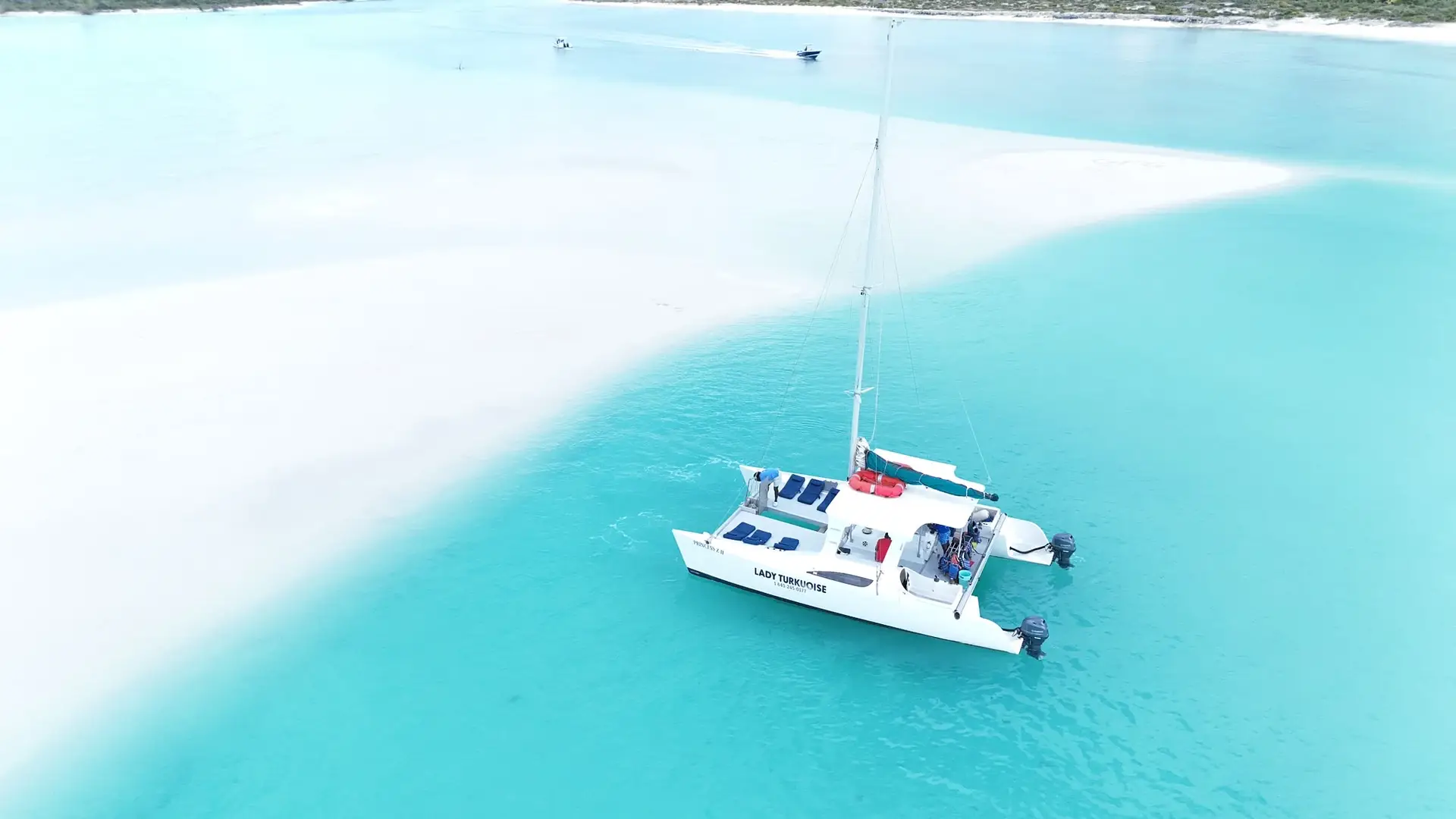 Lady Turkuoise charter boats resting in the turquoise waters of Turks and Caicos